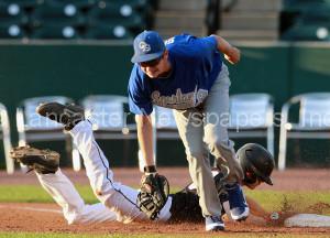 Garden Spot first baseman Ryan Smith (18) tags Lititz Oddfellows' Luke Mariano on a first-inning pickoff. (Chris Knight photo) 