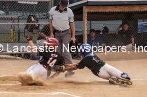 Warwick's Collin Beech narrowly avoids the tag by Cocalico's Jude Anthony.