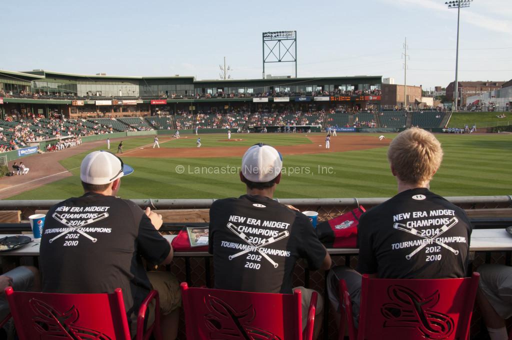 Players from Strasburg-Willow Street watch the Barnstormers game from the picnic area while wearing their new champinship T-shirts. (Brian Leid photo)