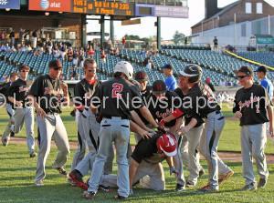 Hempfield Black's bench comes out and mobs teammate Tanner Seitz (14) after he smacked the game winning run against Strasburg Willow Street during 10th inning action of an LNP Tournament quarterfinal game at Clipper Magazine Stadium in Lancaster Wednesday July 22, 2015.(Photo/Chris Knight)