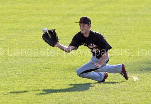 Hempfield Black left fielder Matt Brooks (27) comes up and make s the catch against Cocalico during 6th inning action of an LNP Tournament Midget Semifinal game at Clipper Magazine Stadium in Lancaster Friday July 24, 2015.(Photo/Chris Knight)