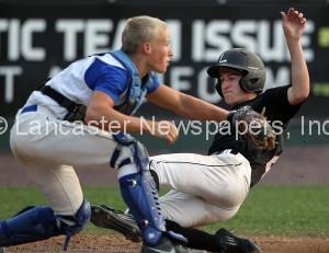 Lititz Oddfellows Tyler Martin (4) scores as Cocalico catcher Brady Martin (11) waits for th throw during 6th inning action of an LNP Tournament Midget Championship game at Clipper Magazine Stadium in Lancaster Sunday July 26, 2015.(Photo/Chris Knight)