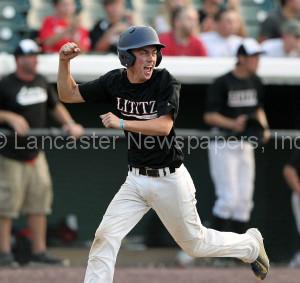 Lititz Oddfellows Adam Ricketts (13) reacts as he comes in to score against Cocalico during 6th inning action of an LNP Tournament Midget Championship game at Clipper Magazine Stadium in Lancaster Sunday July 26, 2015.(Photo/Chris Knight)
