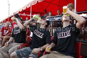 Lititz Oddfellows  Bryce Zimmerman left, Tyler Hess middle, and Justin Byler Right, participated in the Turkey Hill Tea chugging contest in the middle of the 3rd inning. Justin Byler Right won the contest at Clipper Magazine Stadium in Lancaster on Tuesday, July 28, 2015. (Photo / Kirk Neidermyer)